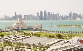 Buildings in Doha and lone upright sculpture