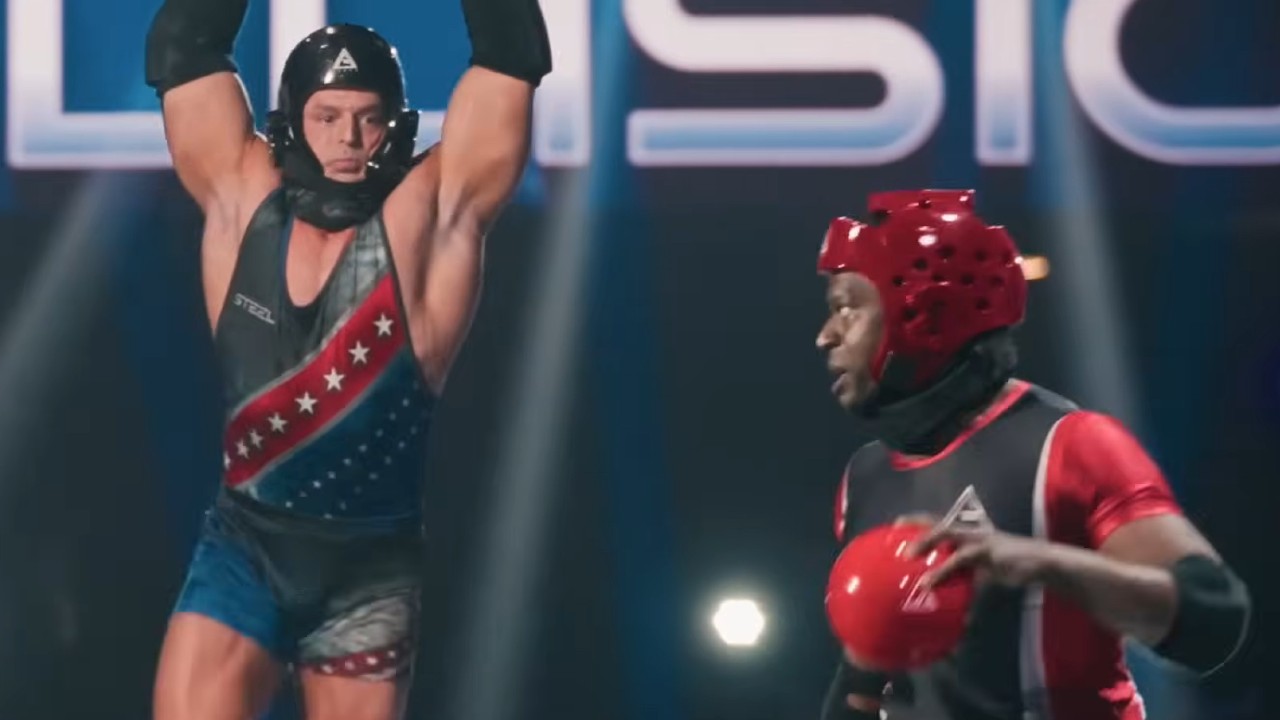 Jessie Godderz coming after a contestant on American Gladiators.