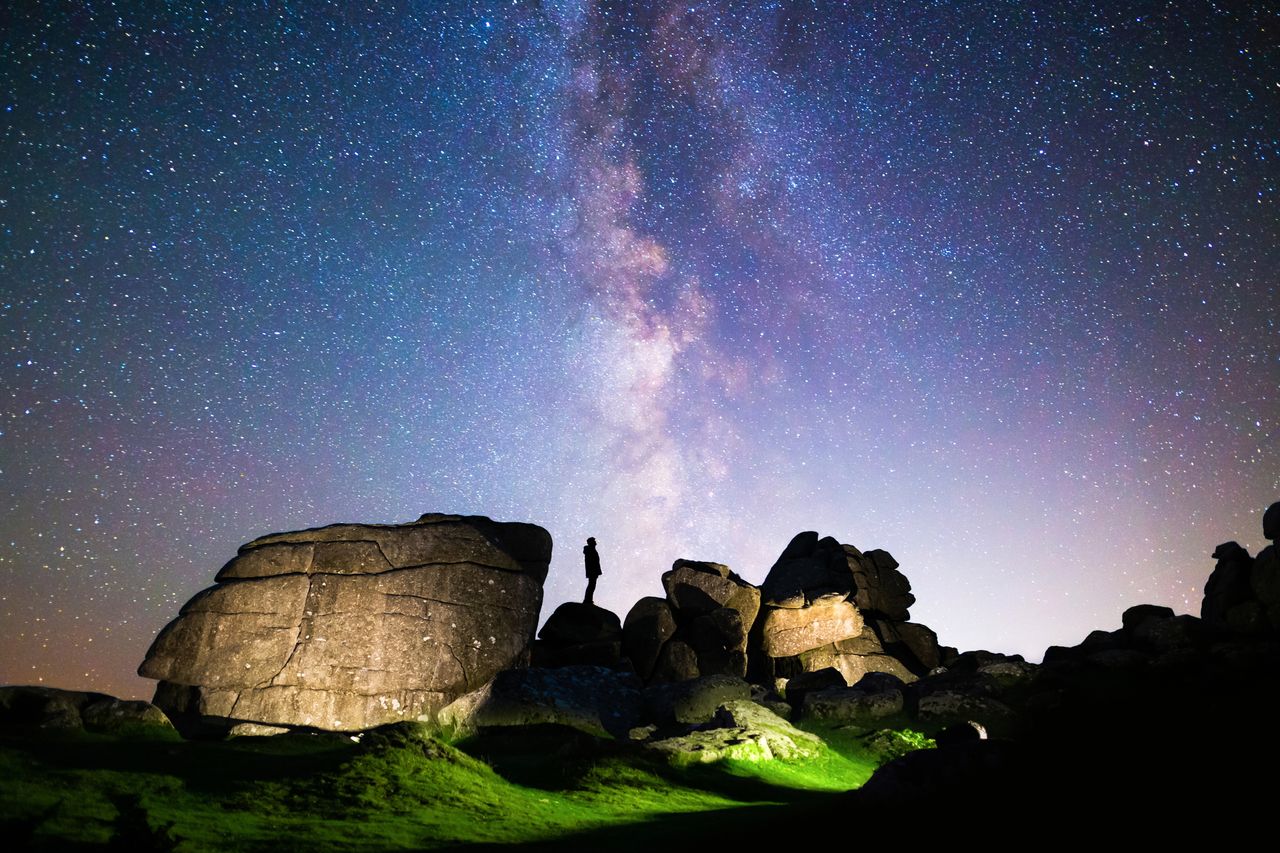 A man stares at the Milky Way in Dartmoor National Park