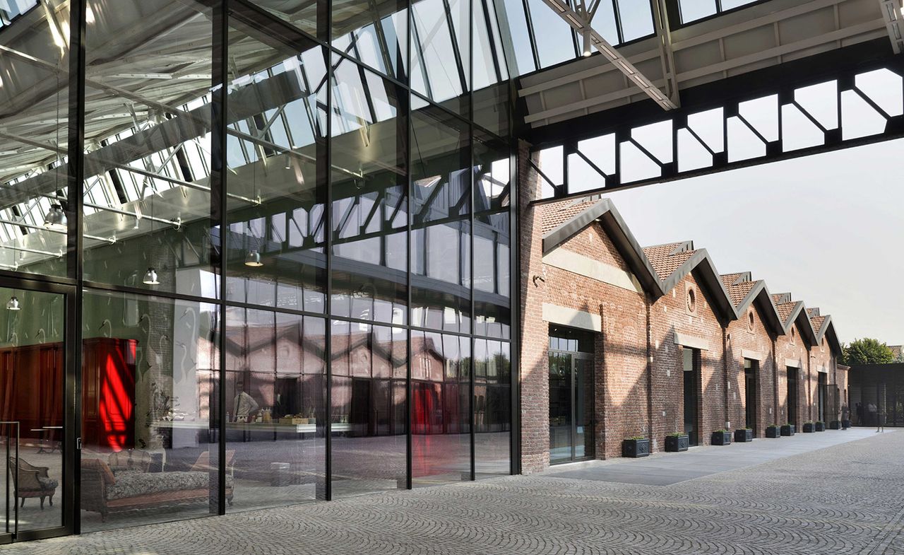 Exterior view of new Gucci stores with large mirrored glass walls