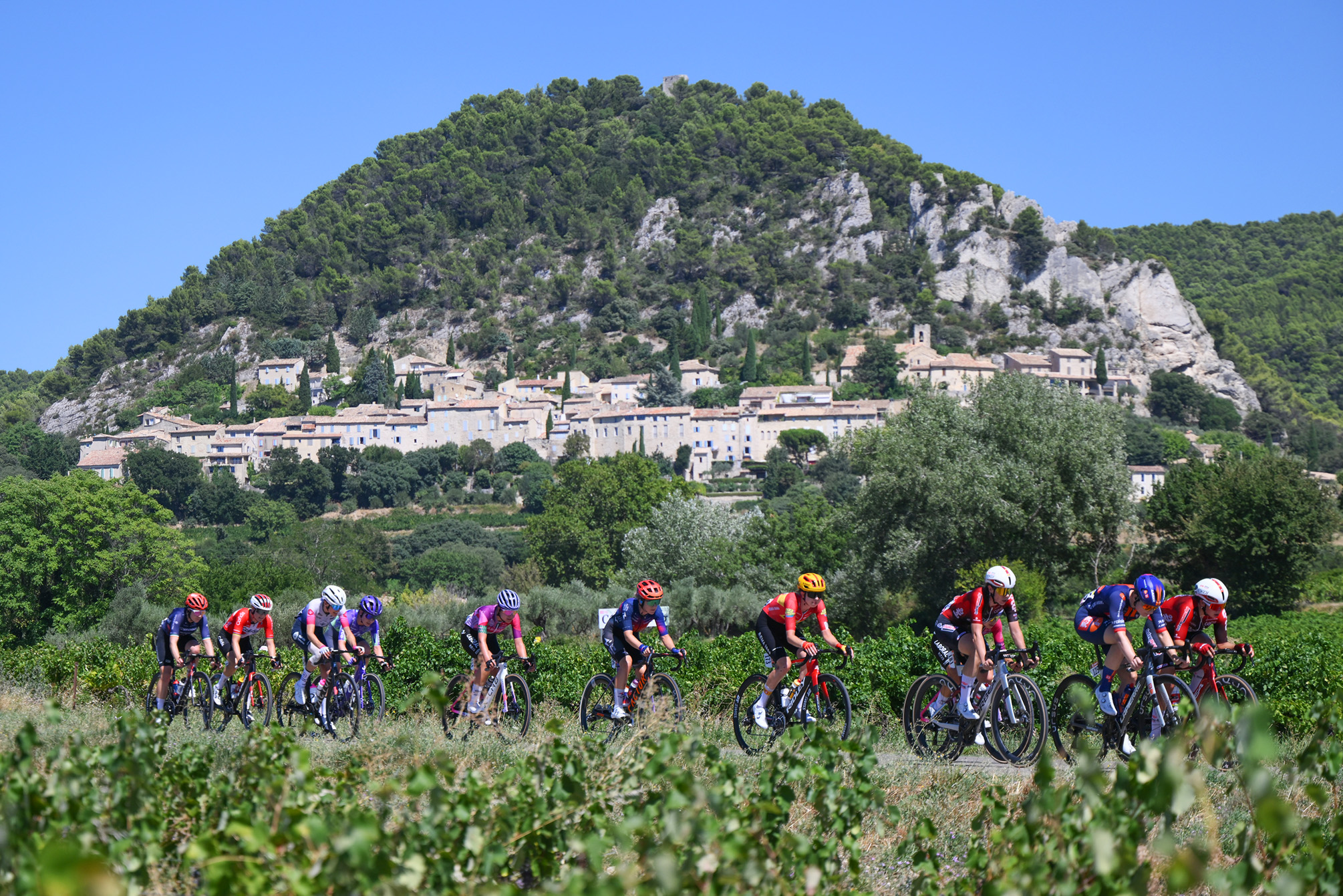 MONT VENTOUX, FRANCE - AUGUST 07: Sandrine Tas and Romina Hinojosa of Team Lotto Intermarche Ladies compete in the breakaway passing Seguret village during the 5th Tour de France Femmes 2026, Stage 7 a 146.8km stage from La Voulte-sur-Rhone to Mont Ventoux 1901m / #UCIWWT / on August 07, 2026 in Mont Ventoux, France. (Photo by Alex Broadway/Getty Images)