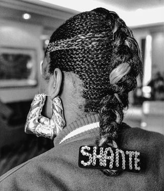 Roxanne Shante. Gold door knocker earrings and “Shante” nameplate hair adornment. David Corio, London, 1989.