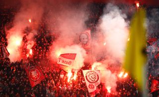 Olympiacos fans light flares ahead of a Greek Superleague match against AEK Athens in 2012.