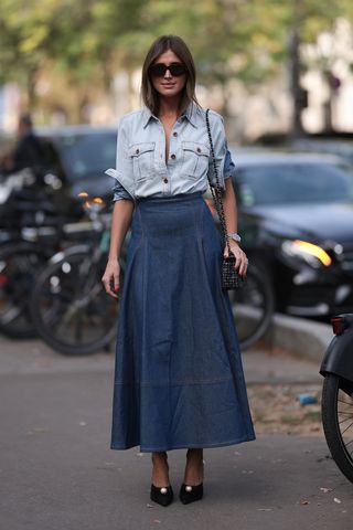 Woman wearing a denim shirt outfit.