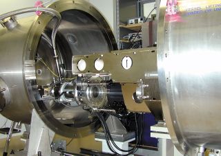The HARPS spectrograph during laboratory tests. The vacuum tank is open so that some of the high-precision components inside can be seen. Image released March 27, 2003.
