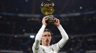 Real Madrid midfielder Luka Modric holds up the Ballon d'Or trophy before the La Liga match between Real Madrid and Rayo Vallecano on 15 December, 2018 at the Santiago Bernabeu, Madrid, Spain