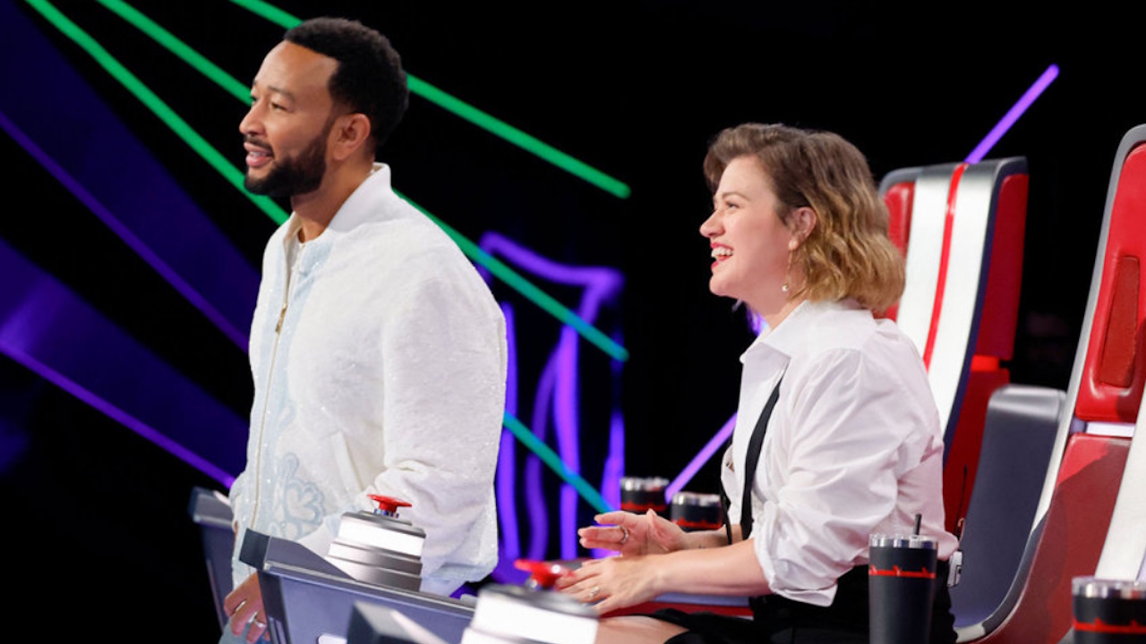 John Legend and Kelly Clarkson watch an artist on The Voice Season 29.