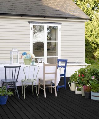 Sadolin painted black deck with dining furniture