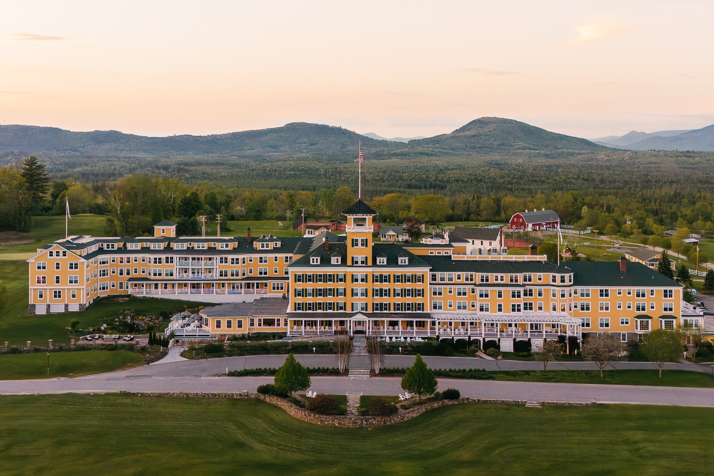 The exterior of the Mountain View Grand Resort &amp;amp; Spa in New Hampshire at sunset