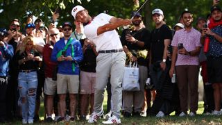 Xander Schauffele takes a shot during the Presidents Cup