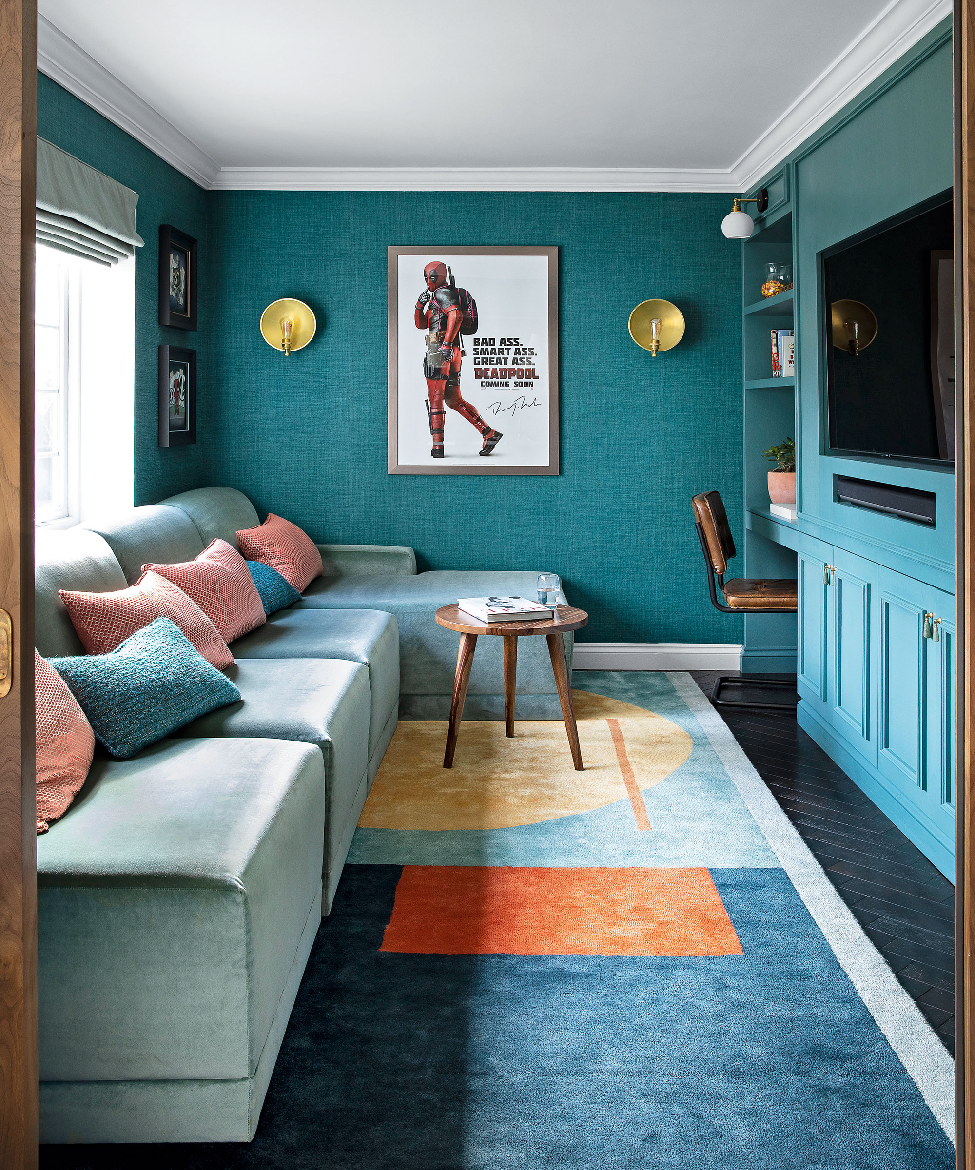 Green small living room with l-shape sofa and tv on the wall