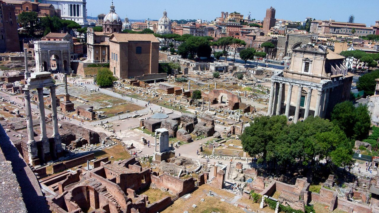 The entrance to the underground temple was found during excavations on the north-west side of the Roman Forum, beneath the steps of the Curia Julia on the center-left of this photograph.