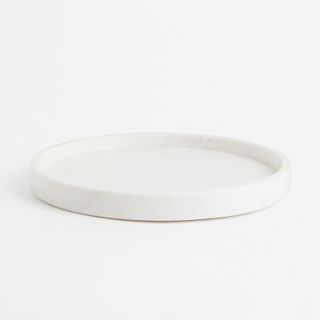 Rounded white marble tray with raised edge