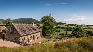 exterior of period home with incredible landscape