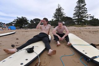Deceuninck-QuickStep teammates Shane Archbold and Sam Bennett share a joke while trying out a bit of surfing on some downtime ahead of the 2020 Cadel Evans Great Ocean Road Race