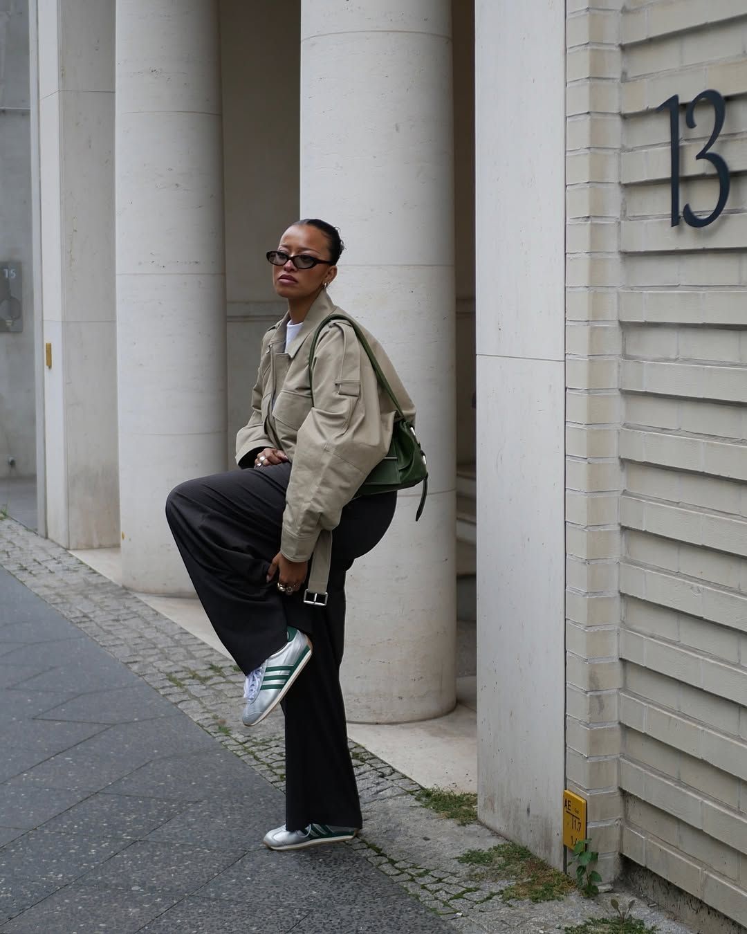 An influencer wearing adidas sneakers.