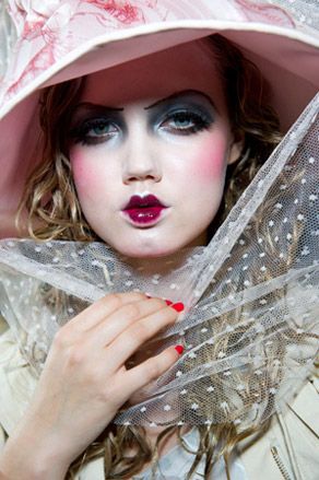 Model wearing very bold theatrical make-up