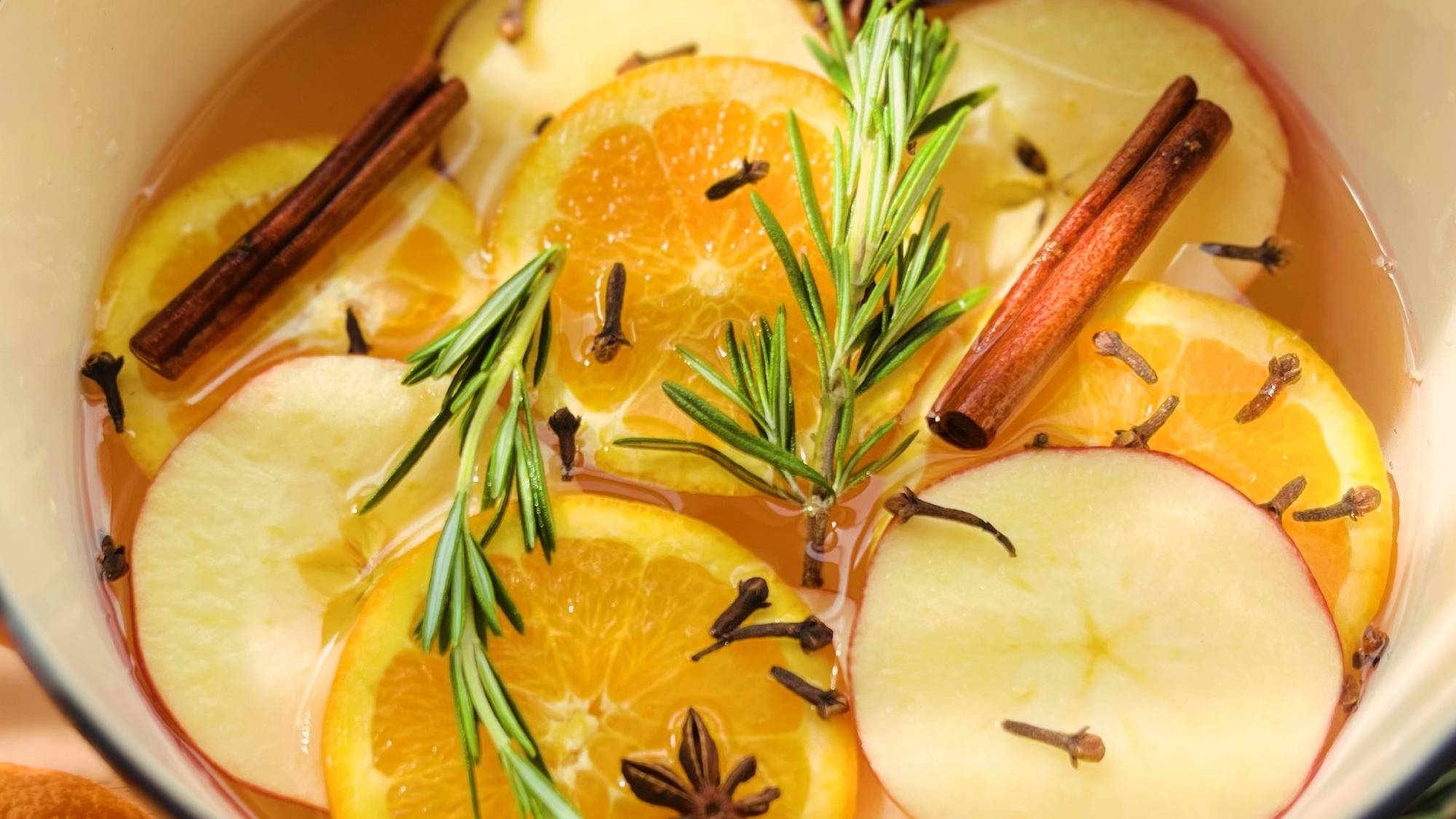 Simmer pot with rosemary, apples, oranges, cloves, and cinnamon