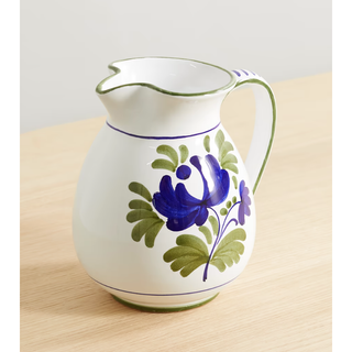 white ceramic jug with a blue floral design