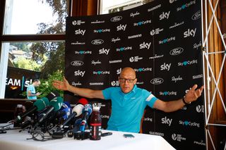 An animated Dave Brailsford speaks with the press during the Tour's second rest day