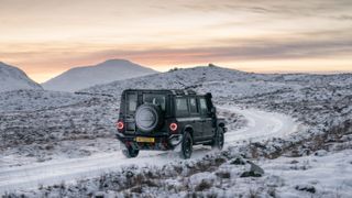 Ineos Grenadier driving through Scottish highlands