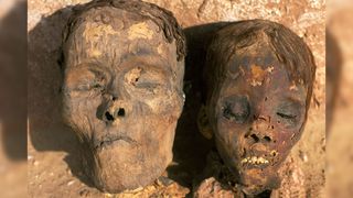 Heads of two mummies that were excavated by archaeologists at mummies at Dakhla Oasis in Egypt.