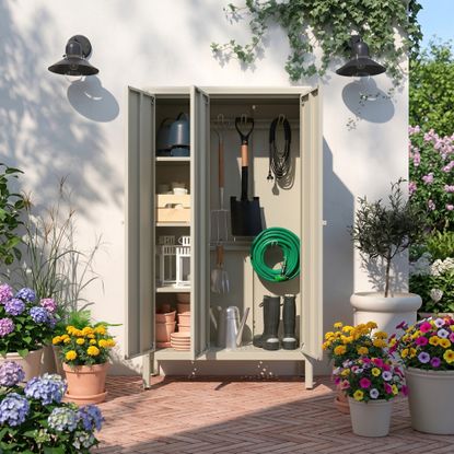 Ikea KOLBJORN garden storage cabinet on a patio, filled with garden tools