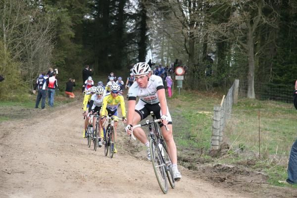Steely focus as the riders navigate the dirt roads around Herning