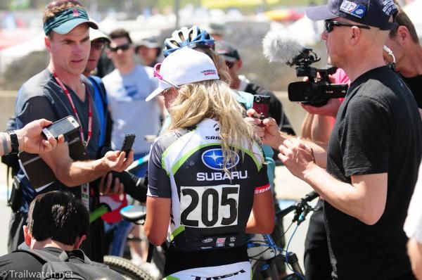 Emily Batty (Trek-Subaru) is mobbed by the media after her win