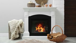 roaring fireplace with white mantle