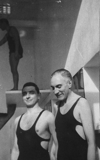 Two males in black swimwear