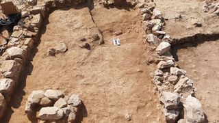 An excavation site of a grave in the desert