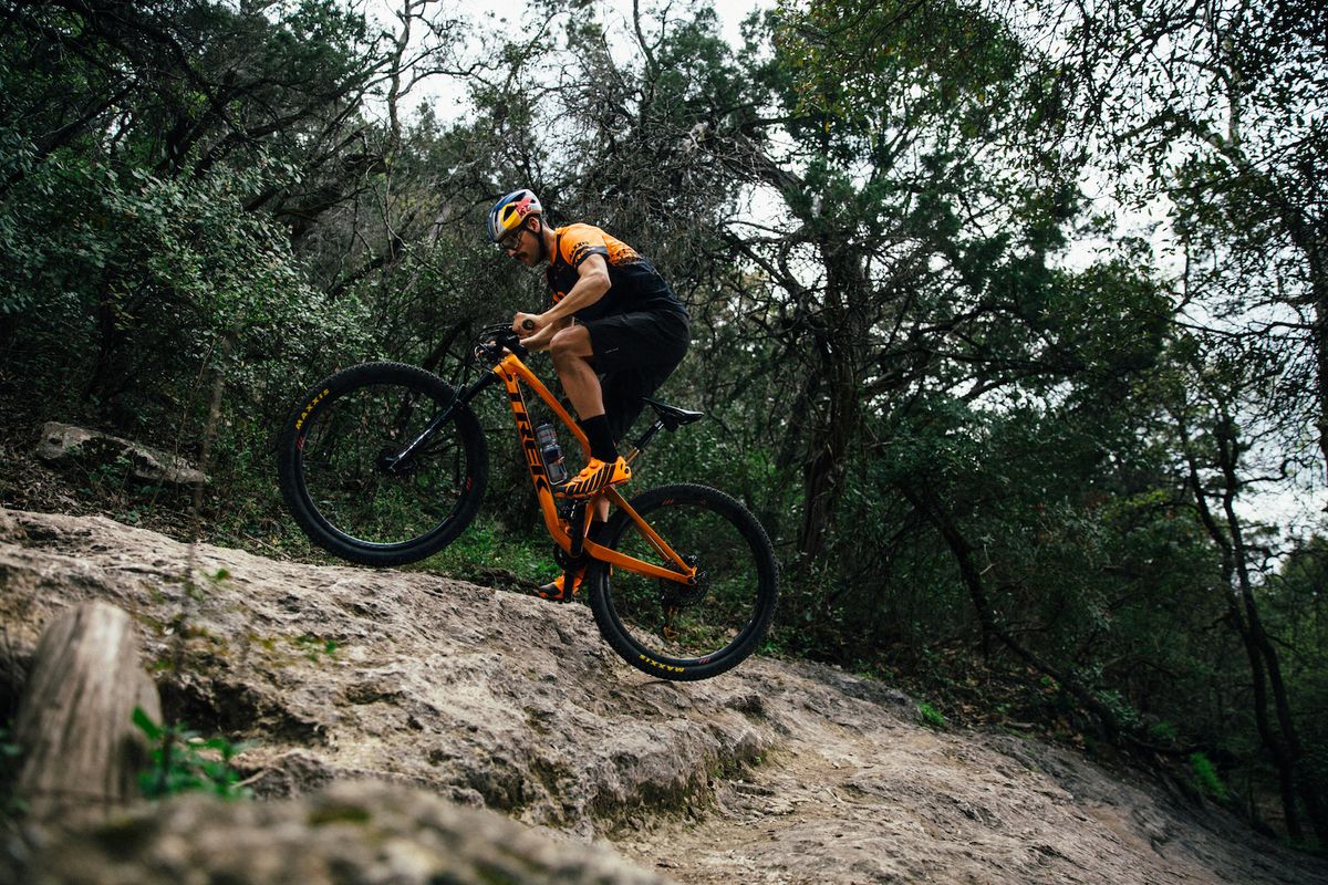 Payson McElveen climbs a ledge on his mountain bike