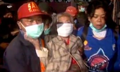 Residents within a four-mile radius of Mount Merapi were being evacuated and given masks to protect them against the ash.