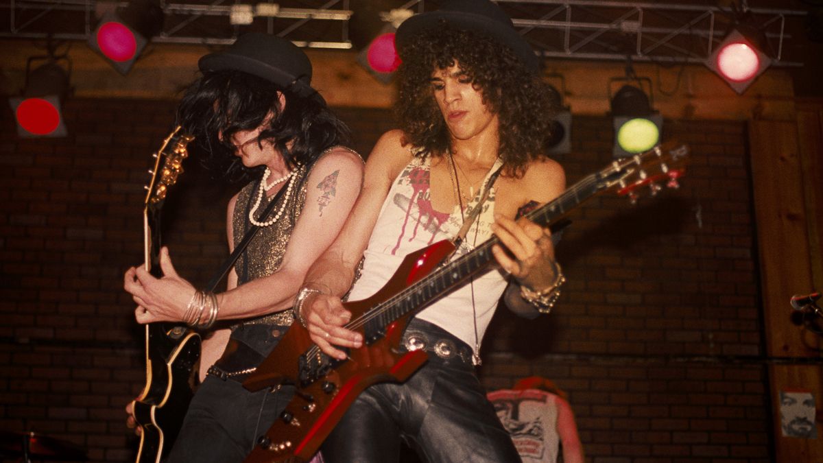 Izzy Stradlin and Slash of the rock band &#039;Guns n&#039; Roses&#039; perform onstage at the Troubadour where the &quot;Appetite For Destruction&quot; lineup played together for the first time on June 6, 1985 in Los Angeles, California.