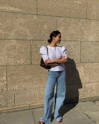 White top over culotte trousers