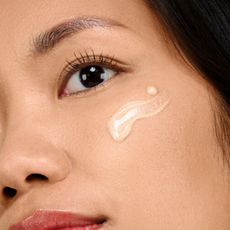 woman's face with b-goldi drops on cheekbone