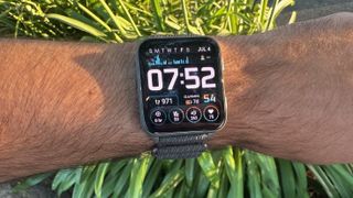 Top-down view of the Garmin Venu X1 with the Snapshot watch face showing multiple data points like stress, VO2 Max, and heart rate.