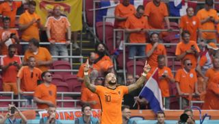 Memphis Depay celebrates after putting Holland ahead against Austria from the penalty spot