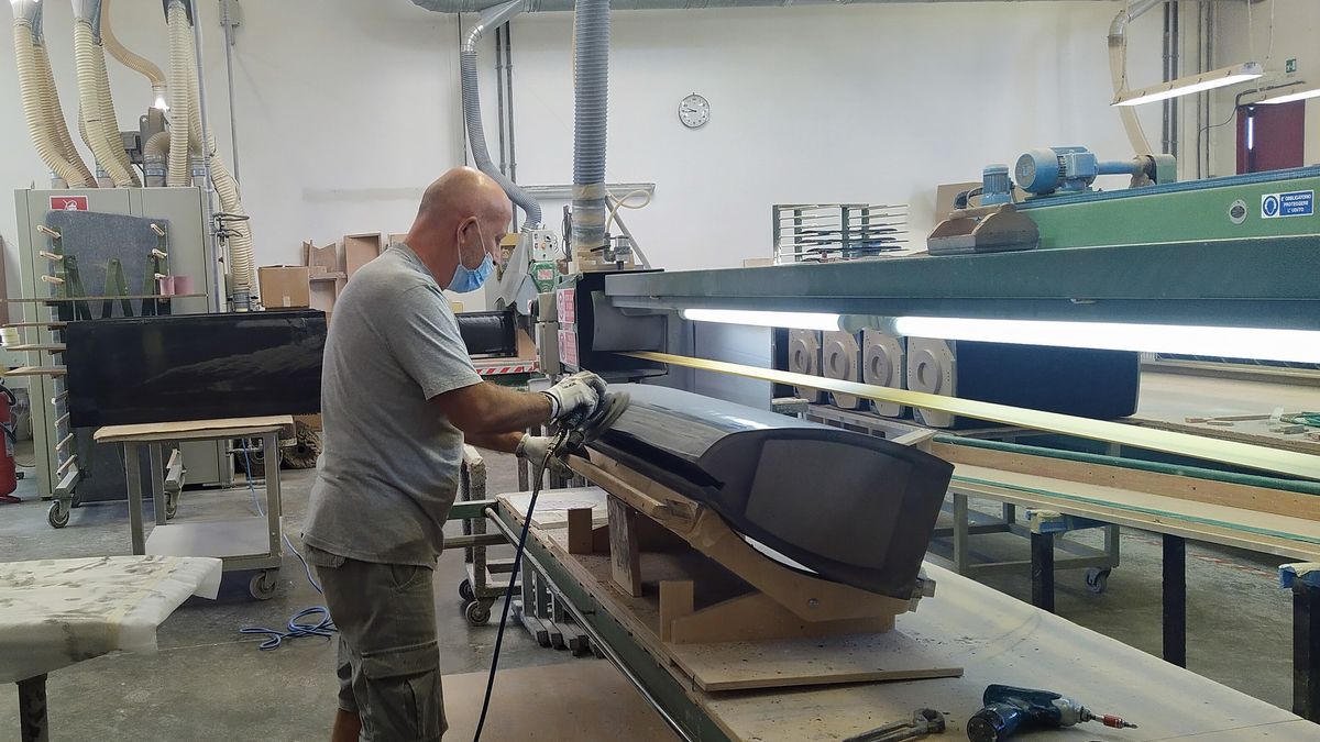 a worker in the sonus faber stereo speaker factory