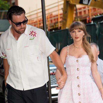 Taylor Swift and Travis Kelce walk together in New York City wearing coordinating outfits