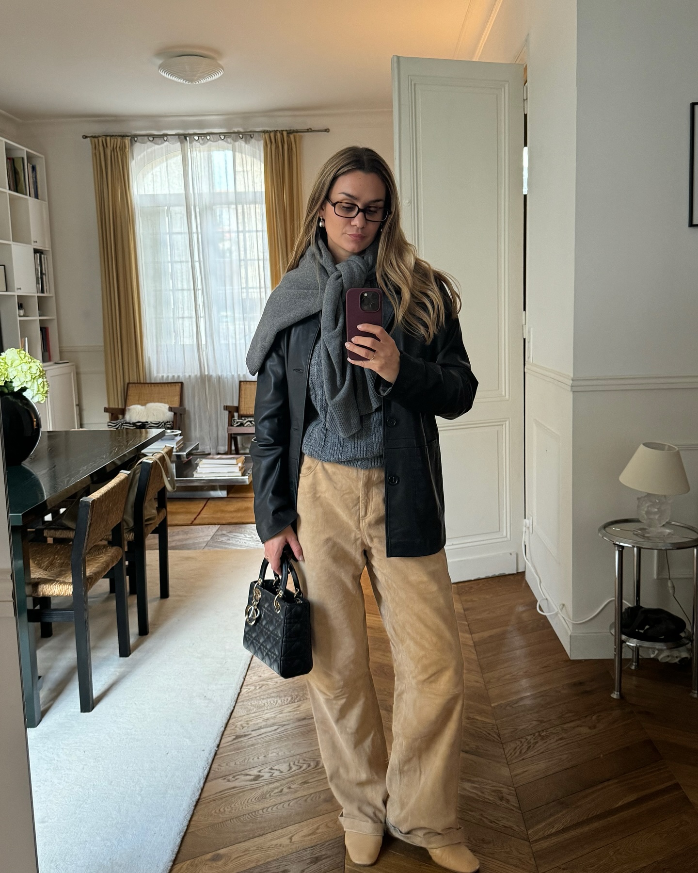 Influencer wears suede trousers.