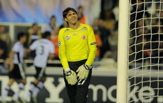 Bursaspor goalkeeper Dimitar Ivankov reacts after conceding a goal against Valencia in November 2010.