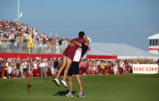Hall hugs her dad and caddie after securing the 2018 Women's Open