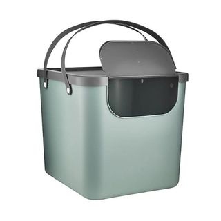 A green recycling box with black handles