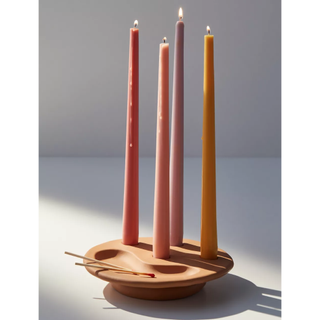 terracotta bowl candle holder with four tapered candles and matches