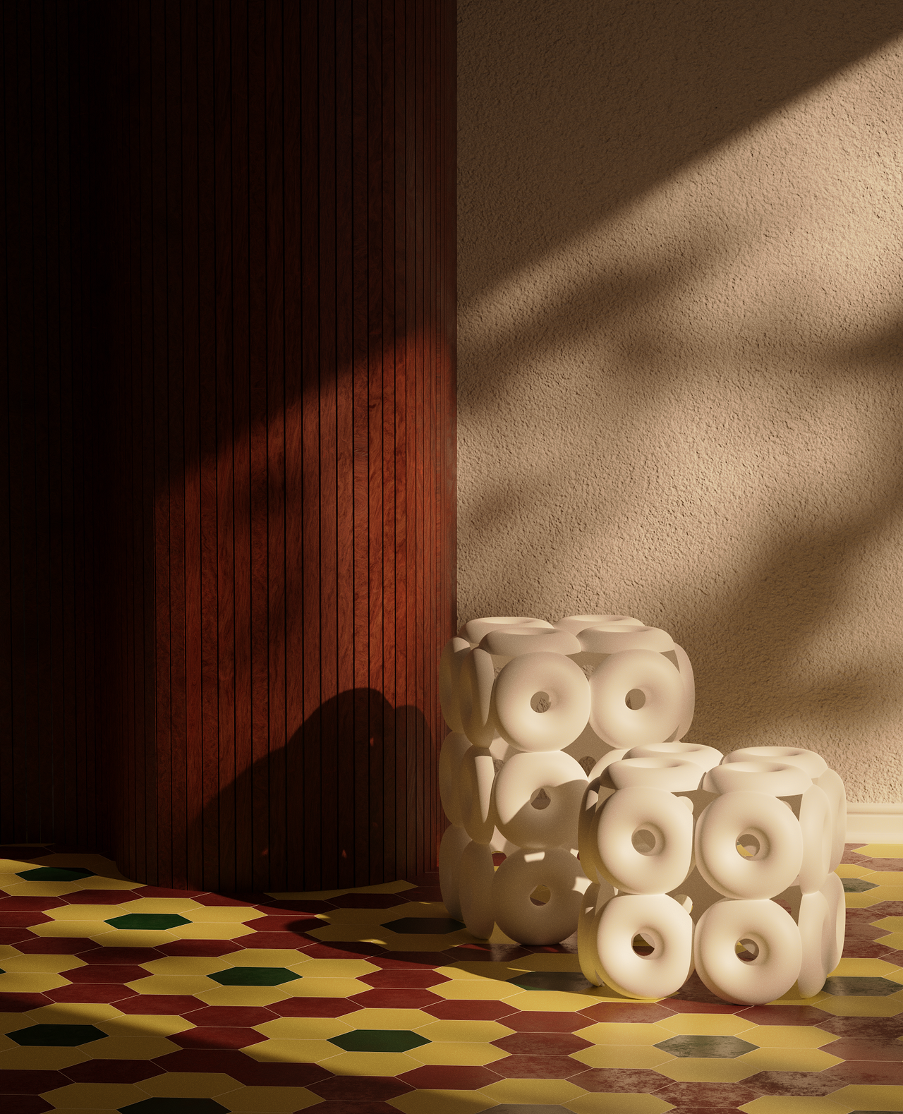 Doughnut-shaped side tables and stools sit in a sun-lit, tiled earthy room.