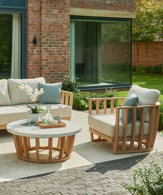 wooden outdoor furniture on a patio