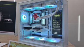The MSI Mag Pano 1130R PZ series case with internal screen, lit up in blue