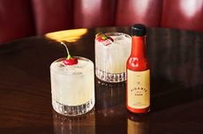 Two Picante de la Casa cocktails on a bar